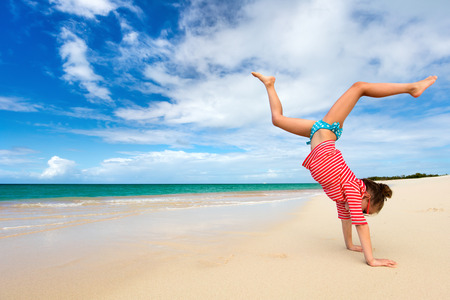 Adorable little girl at beach during summer vacationの写真素材