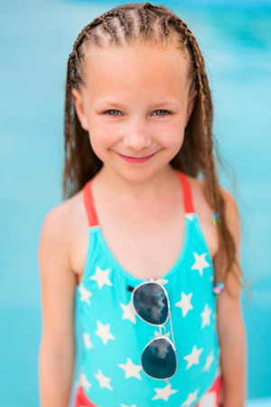 Adorable little girl with Caribbean braids on vacationの写真素材