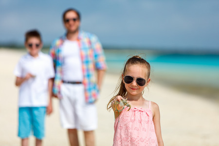 Father and kids enjoying beach vacation on tropical islandの写真素材