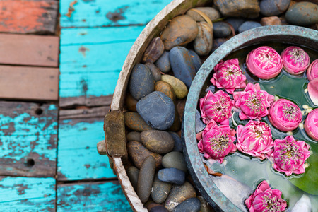 Lotus flowers and spa stones decoration close up in spaの写真素材