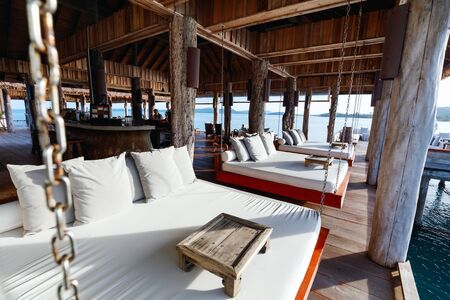 Interior of tropical overwater bar in a luxury resortの写真素材