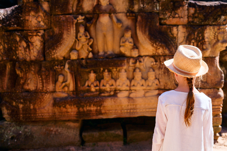 Little girl in ancient Angkor Wat temple in Siem Reap, Cambodiaの写真素材