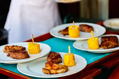 Delicious grilled meat and corn freshly cooked and served for lunch or dinner