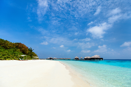 Beautiful tropical beach on exotic island at Maldivesの写真素材
