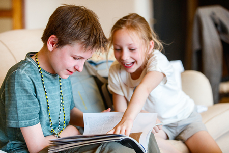 Casual portrait of little kids brother and sisterの写真素材