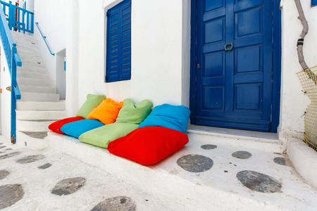 Typical greek traditional village with white walls and colorful doors, windows and balconies on Mykonos Island, Greece, Europeの写真素材