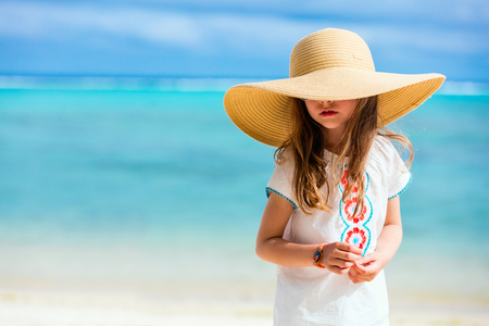 Adorable little girl at beach during summer vacationの写真素材