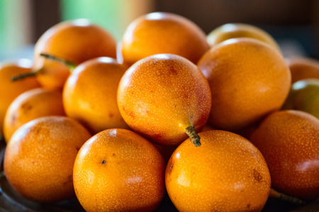 Selection of fresh passion fruits at market for saleの写真素材