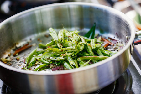 Preparation of traditional Sri Lankan dish with green beans at cooking classの写真素材