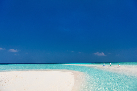 Father and kids enjoying summer beach vacation on tropical islandの写真素材