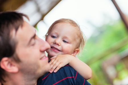 Portrait of happy father and his adorable little daughterの写真素材