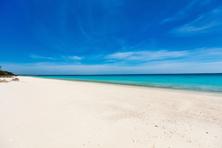Idyllic tropical beach with white sand, turquoise ocean water and blue sky in Mozambique Africaの写真素材