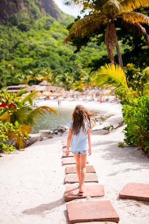Adorable little girl at beach during summer vacationの写真素材
