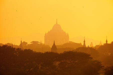 Scenic sunset with thousands of historic buddhist temples and stupas in Bagan Archeological area in Myanmarの写真素材