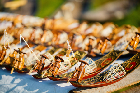 Wooden fishermen souvenirs at market on Inle lake in Myanmarの写真素材