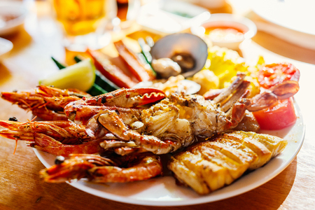 Close up of delicious grilled vegetables and seafood