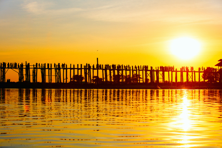 Silhouette of U Bein Bridge Myanmar at sunset, the longest teak bridge in the worldの写真素材