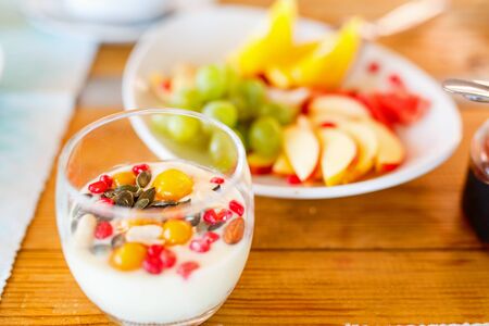 Delicious healthy breakfast youghurt with berries and fruitsの写真素材