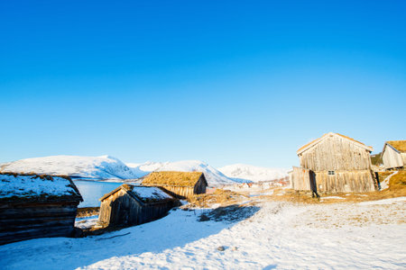 Beautiful winter landscape of Northern Norway with wooden huts overlooking breathtaking fjords...