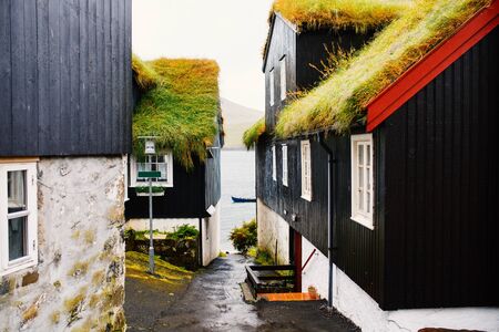 Traditional black houses with grass roof of historic district of Torshavn in Faroe Islandsの写真素材