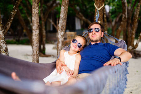 Happy father and his adorable little daughter laughing together having funの写真素材
