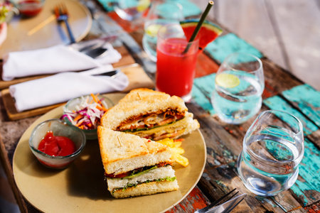 Delicious fresh fish sandwich and green salad served for lunch