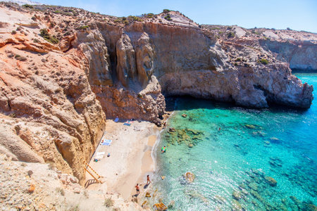Idyllic Tsigrado beach surrounded by beautiful cliffs on Greek island of Milosの写真素材