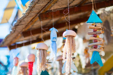Wooden souvenirs for sale in Klima fishing village on Milos island in Greeceの写真素材