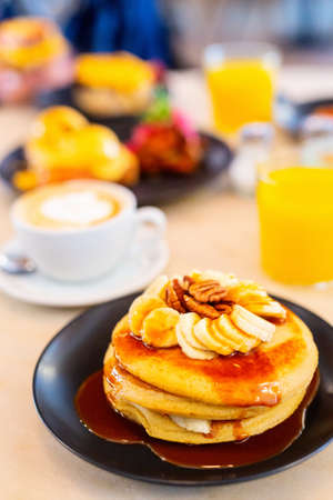Delicious banana pancakes served for breakfastの写真素材