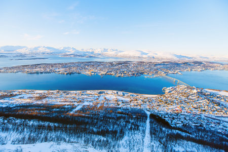 Above view of beautiful winter landscape of snow covered town Tromso in Northern Norwayの写真素材