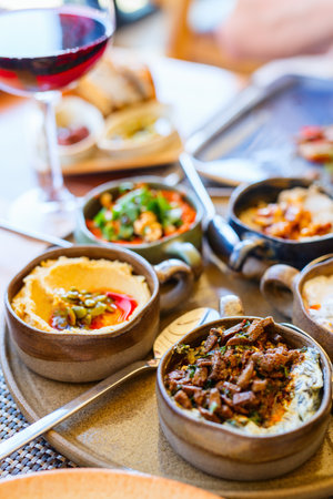 Selection of traditional turkish appetizers including spinach borani with beef liverの写真素材