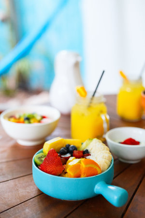 Smoothie bowl topped with fresh fruits served for breakfastの写真素材