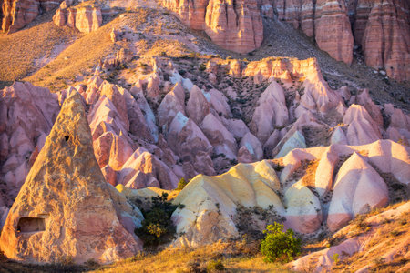 Stunning view of Rose and Red valley rock formations in Cappadocia Turkey at sunsetの写真素材