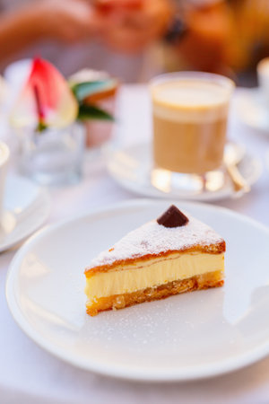 Close up of delicious cheesecake dessert and coffee served at cafe or restaurantの写真素材