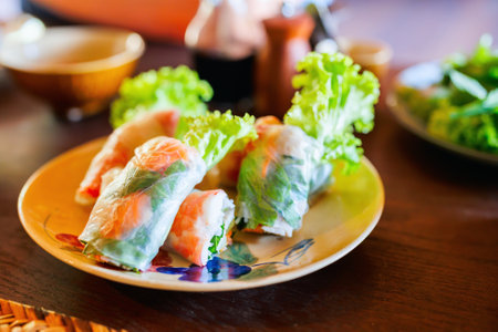 Traditional vietnamese spring rolls served with other small bites for lunchの写真素材
