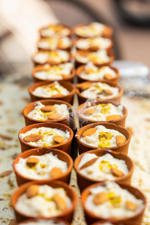 Lassi popular Indian drink served in traditional terracotta earthen tumblers at street stall near Chandni Chowk spice market in Old Delhi Indiaの写真素材