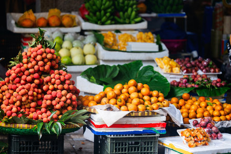 Fresh organic fruits and vegetables in outdoor street market in Hanoi Vietnamの写真素材