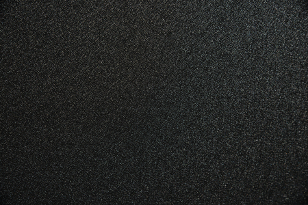 Abstract background from black zinc plate with sunlight in dark tone. Industrial backdrop.の写真素材