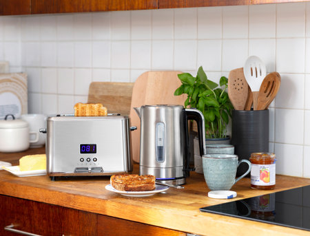 Toaster and kettle on kitchen with toastの写真素材