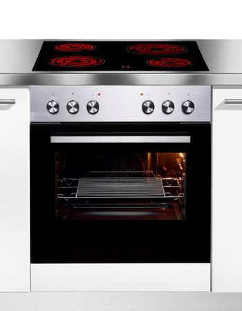 Built in oven and induction stove in kitchen countertopの写真素材