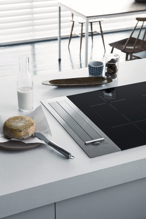 Modern induction stove with extractor hood in the kitchenの写真素材