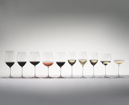 Row of glasses with champagne and red and white wineの写真素材