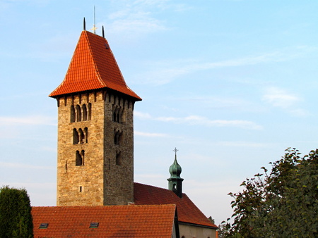 Romanesque tower and part of the roof of a rural church in the village of Chrenovice, horizontal shotの写真素材