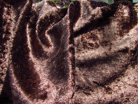 Brown furry fabric, shiny velvet close-up, photo backgroundの写真素材