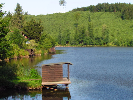 Wooden fishing huts near the lake, sport fishingの写真素材