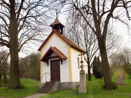 rural chapel with a cross, early springtime, Czech Republicの写真素材