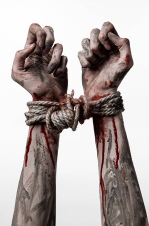 Hands bound,bloody hands, mud, rope, on a white background, isolated, kidnapping, zombie, demon studioの写真素材