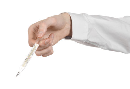 Medical theme: doctor's hand holding a thermometer to measure the temperature of the patient on a...