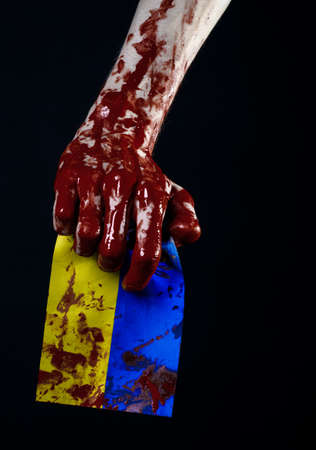Bloody hands, the flag of Ukraine in the blood, revolution in Ukraine, Black backgroundの写真素材