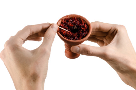Hookah topic: Bartender holding a clay bowl with tobacco for hookah isolated on white backgroundの写真素材